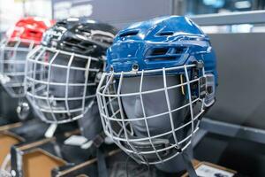 Assortment of Hockey Helmets in Blue and Red with Visors Store Display photo