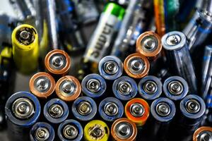 Salt and alkaline batteries, a source of energy for portable technology. AAA and AA batteries photo