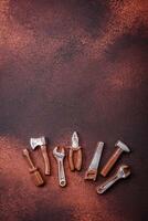 Tools and inscriptions symbolizing repairs or a garage and its attributes on a plain background photo