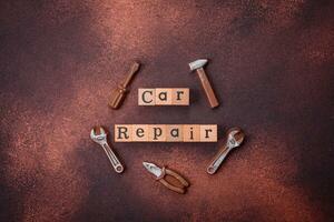 Tools and inscriptions symbolizing repairs or a garage and its attributes on a plain background photo