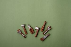 Tools and inscriptions symbolizing repairs or a garage and its attributes on a plain background photo