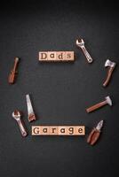 Tools and inscriptions symbolizing repairs or a garage and its attributes on a plain background photo