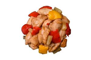 A delicious dish consisting of slices of chicken, sweet peppers and onions photo