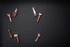 Tools and inscriptions symbolizing repairs or a garage and its attributes on a plain background photo