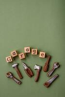 Tools and inscriptions symbolizing repairs or a garage and its attributes on a plain background photo