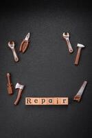 Tools and inscriptions symbolizing repairs or a garage and its attributes on a plain background photo