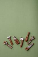 Tools and inscriptions symbolizing repairs or a garage and its attributes on a plain background photo