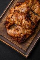 Delicious fresh crispy chicken grilled with salt, spices and herbs photo