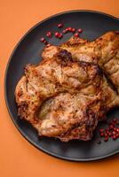 Delicious fresh crispy chicken grilled with salt, spices and herbs photo