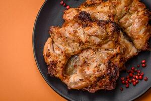 Delicious fresh crispy chicken grilled with salt, spices and herbs photo