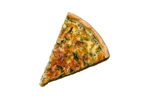 Delicious fresh quiche with broccoli, cheese, spices and herbs cut into pieces photo