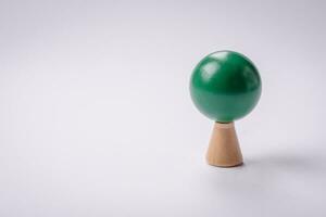 Wooden model of a tree with a green crown and trunk on a white background photo