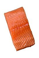 Fresh raw salmon red fish fillet with salt and spices photo