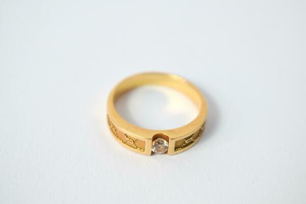 Close Up Golden ring with diamond on isolated white background