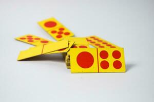 dominoes playing cards isolated white background, yellow red dominoes cards photo