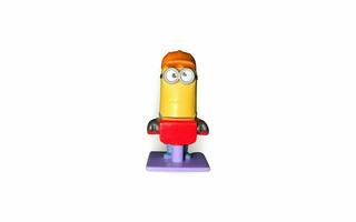 a toy figure of a minion with a red hat photo