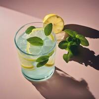 AI generated a glass of lemonade with mint leaves on top photo