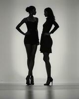 AI generated Silhouette of three women in black and white dresses, studio shot. ai generative photo