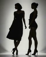 AI generated Silhouette of three women in black and white dresses, studio shot. ai generative photo