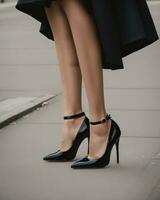 AI generated cropped view of woman in black dress and red high heeled shoes. ai generative photo