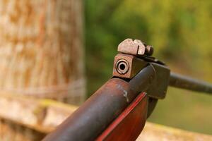 Close-up of a hunting rifle, with a shallow depth of field. photo