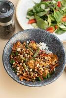 Bowl with tasty rice, meat and vegetables and salad flat lay, top view. photo