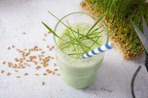 Smoothie with microgreeen and sprouted microgreen wheat sprouts. Healthy food concept photo