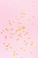 Sparkle stars shape on a pink background. Happy new year background photo