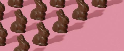 Chocolate rabbit pattern symbol to Easter holidays on a pink banner background. photo