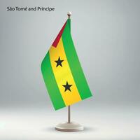 Flag of Sao Tome and Principe hanging on a flag stand. vector