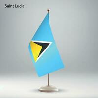 Flag of Saint Lucia hanging on a flag stand. vector