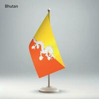 Flag of Bhutan hanging on a flag stand. vector