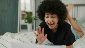 Online Learning, African American Student, Distance Lesson, Education at Home, Webinar Conference. African American woman uses laptop while making an online call. Greetings with a waving hand video