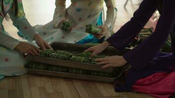 Close-up hand women in traditional costumes produce Vietnamese pork sausages, Vietnamese food. video