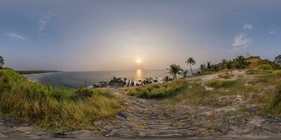 360 hdri panorama with coconut trees on ocean coast on mountain in equirectangular spherical seamless projection photo