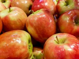 Closeup and crop California red apples background and wallpaper. photo