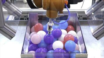 Robot hand machine picking up ball. Media. Use smart robot in manufacturing industry. Robot engineering concept photo