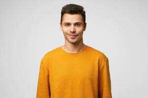 Portrait of a young handsome attractive charming guy looking confidently flirting slightly smiling, pleasant appearance, wants to meet learn a good girl, standing against white background. photo