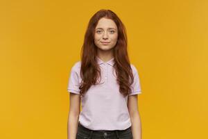 girl standing over yellow background photo