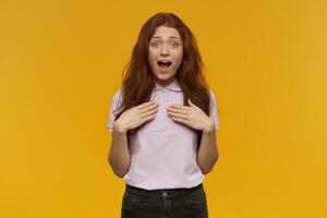 girl standing over yellow background photo