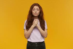 girl standing over yellow background photo