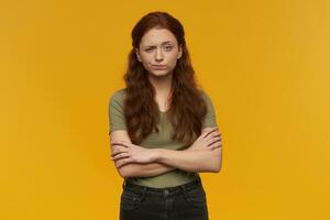 girl standing over yellow background photo