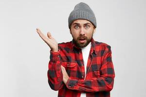 Come on, it is your problem Portrait of pissed off frustrated european guy in checkered shirt, spreading hand and standing in aggressive pose over white background, angry and dissatisfied photo