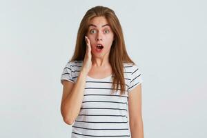 a woman is making a surprised face while holding her hands out photo