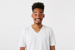 Closeup of surprised smiling african american young man with afro hairstyle photo