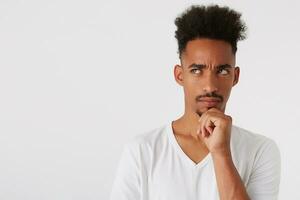 Portrait of thoughtful handsome african american young man with afro hairstyle photo