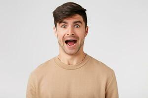 Guy is in a panic before the girl comes to visit. Attractive brunette is waiting for the guests going through distraught that does not have time to get ready photo