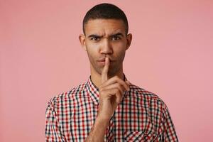 man standing over pink background photo