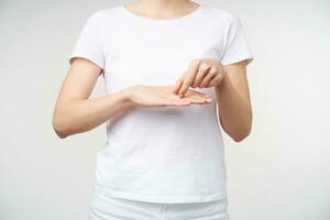 Cropped shot of female's hands showing word wife and husband using sig language, posing over white background. Hand gestures of people with hearing impairment photo