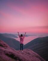 AI generated young woman hiker open arms on top of a mountain at sunrise. ai generative photo